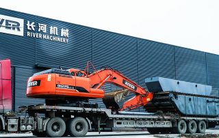 Amphibious excavator loading and shipping