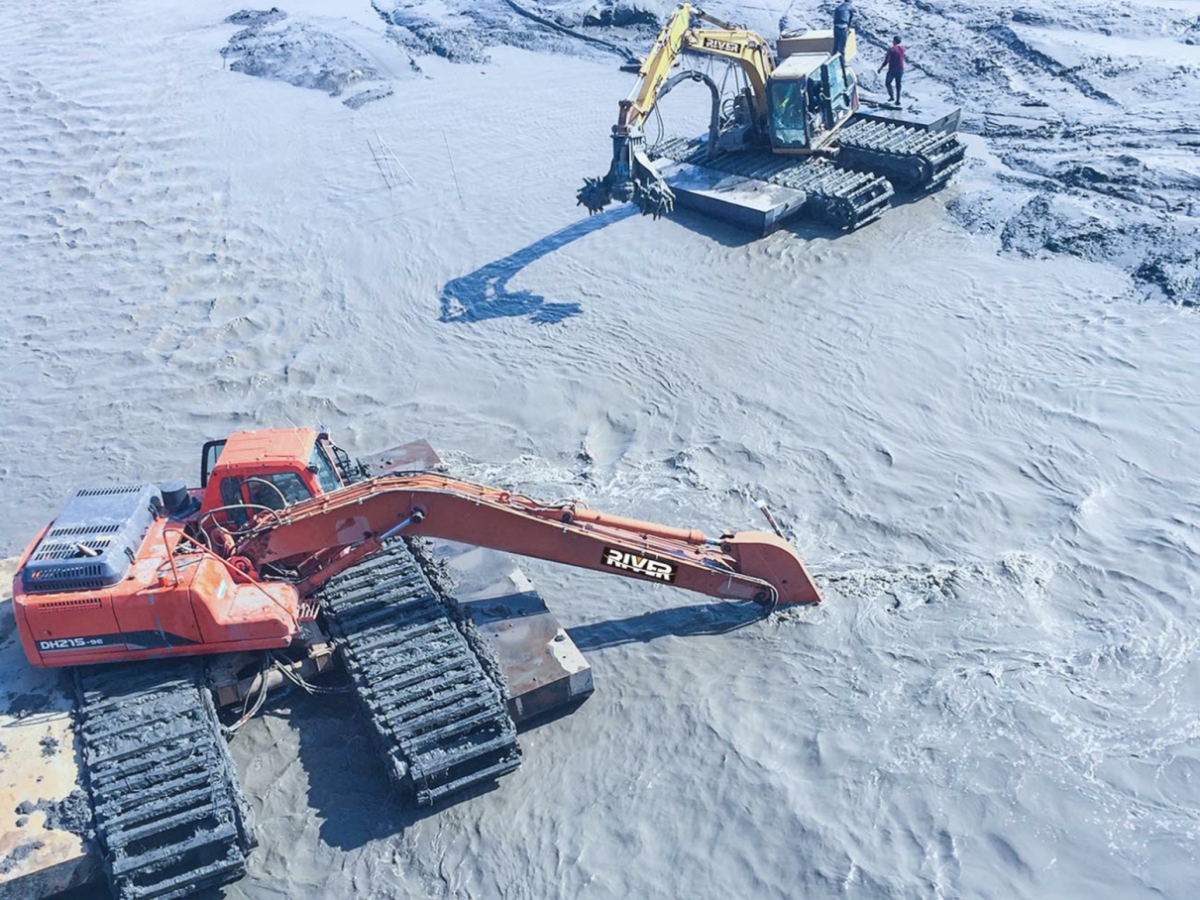 Amphibious Excavators Working in The Mud