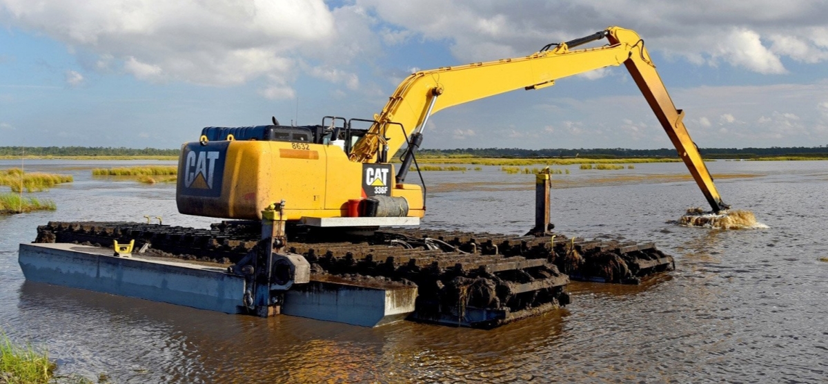 Amphibious Excavators Working in the Fishponds
